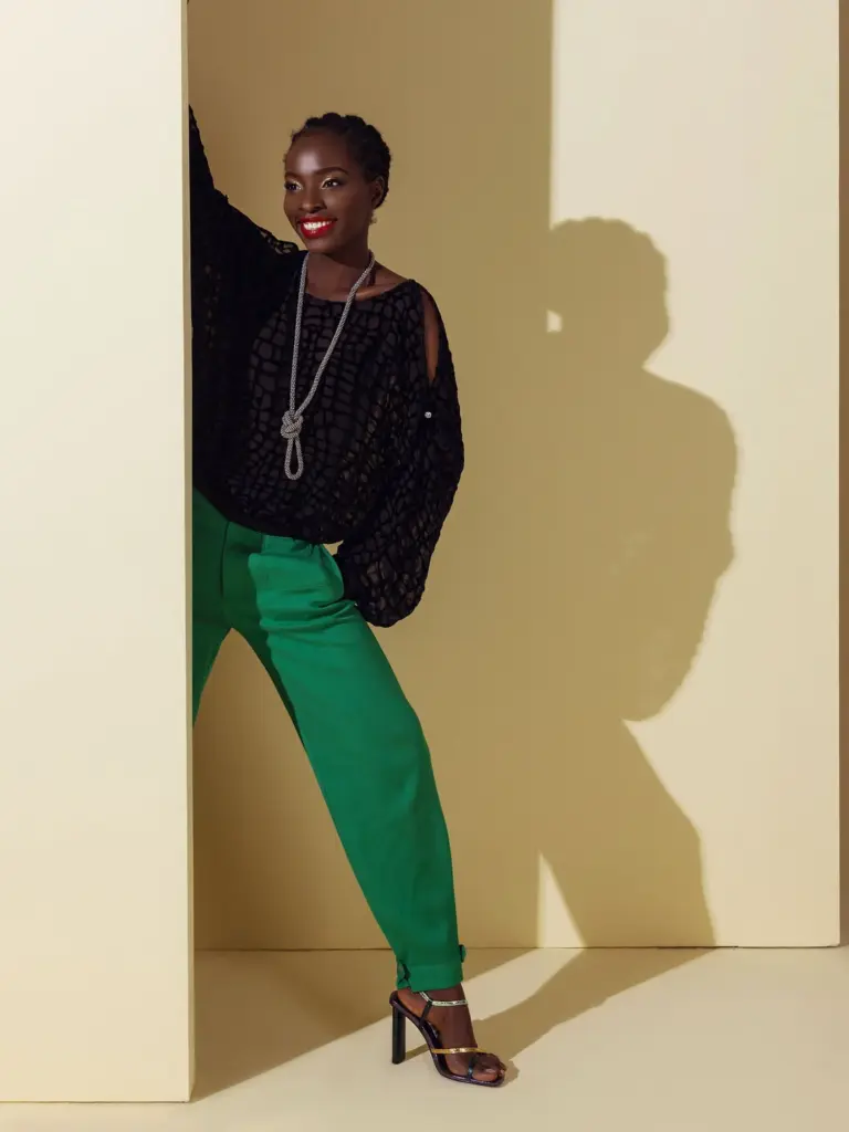 A sophisticated ensemble featuring a green burnout velvet top paired with casual emerald green silk pants, highlighting mixed media manufacturing.