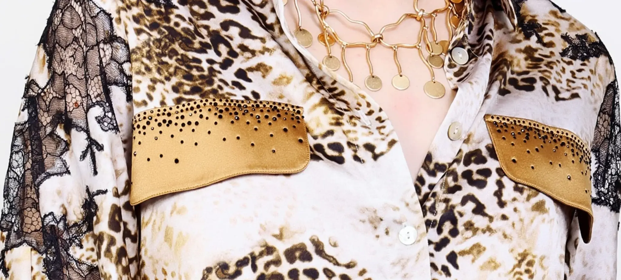 Close-up of leopard print silk blouse with French lace and Swarovski crystal embellishment