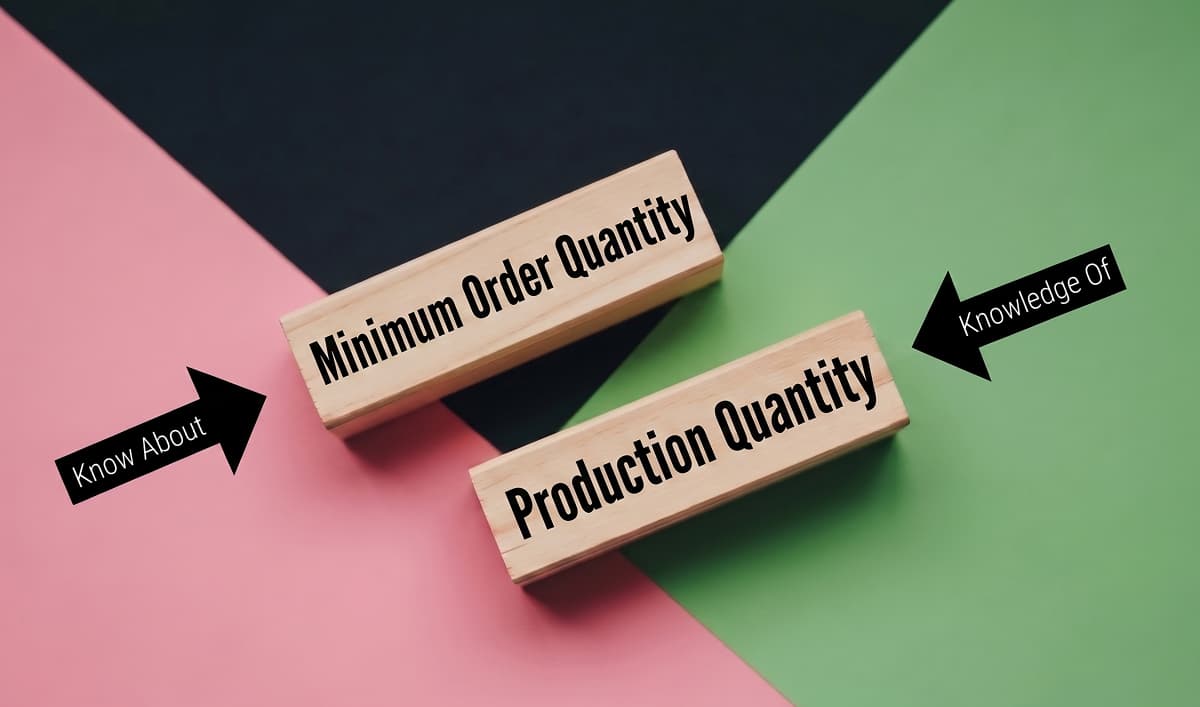 Wooden blocks stacked to spell MOQ representing Minimum Order Quantity explained for fashion brand manufacturing